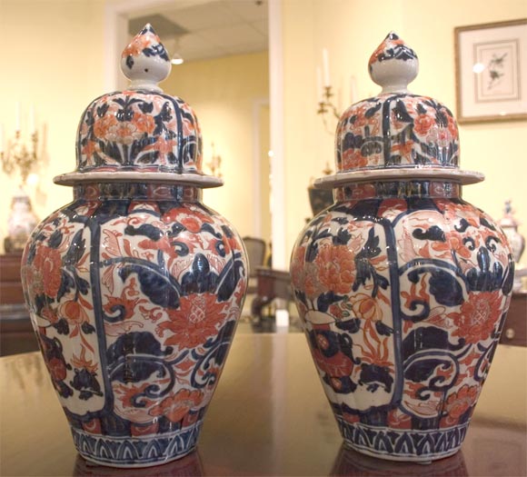 Pair of vividly painted Imari Urns, with a scalloped form giving these beautiful pieces a nice texture. c. 1860<br />
<br />
<br />
IMPORTANT: We are just now placing our inventory online through www.1stdibs.com, and it will naturally take a