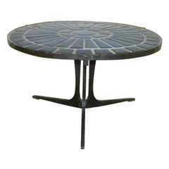 A French Ceramic Tiled Wrought Iron Table.