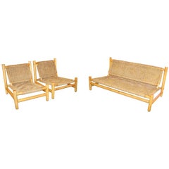 Settee &Pair of Lounge Chairs in the style of Charlotte Perriand