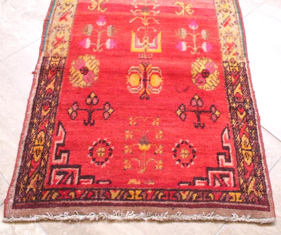 Central Asian carpet with multi-tonal red field with tree-of-life motif and auspicious Chinese fruits and flowers.<br />
<br />
Pagoda Red Collection #:  CRA0338