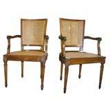 Pair of Provincial Louis XV Style Walnut Caned Fauteuils
