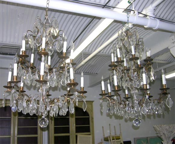 Pair of crystal and bronze 4-tiered chandeliers by Jansen, from an estate decorated by Mr. Boudin, former president of Maison Jansen.