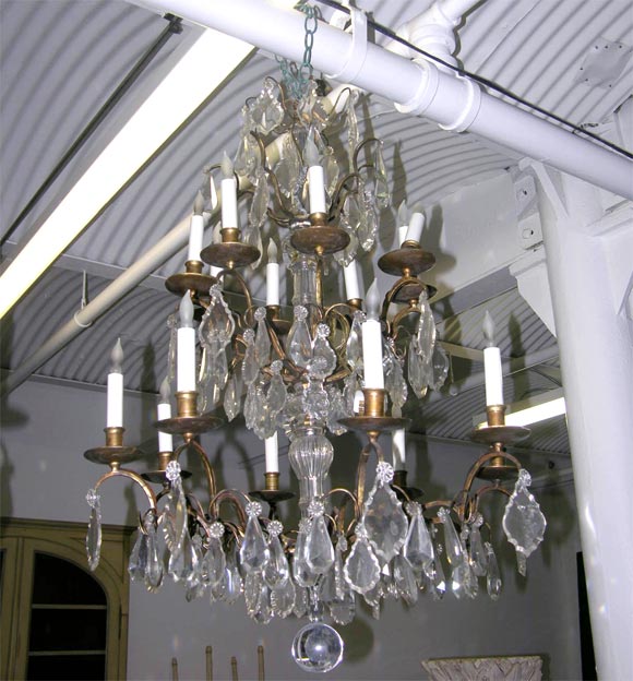 Pair of Crystal and Bronze 4-Tiered Chandeliers by Jansen In Excellent Condition For Sale In New York, NY