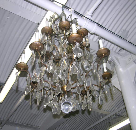 Mid-20th Century Pair of Crystal and Bronze 4-Tiered Chandeliers by Jansen For Sale