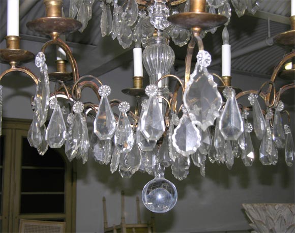 Pair of Crystal and Bronze 4-Tiered Chandeliers by Jansen For Sale 1