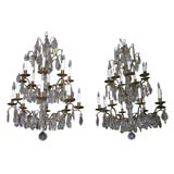 Pair of Crystal and Bronze 4-Tiered Chandeliers by Jansen