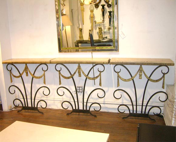 Set of three hammered iron consoles by Edgar Brandt