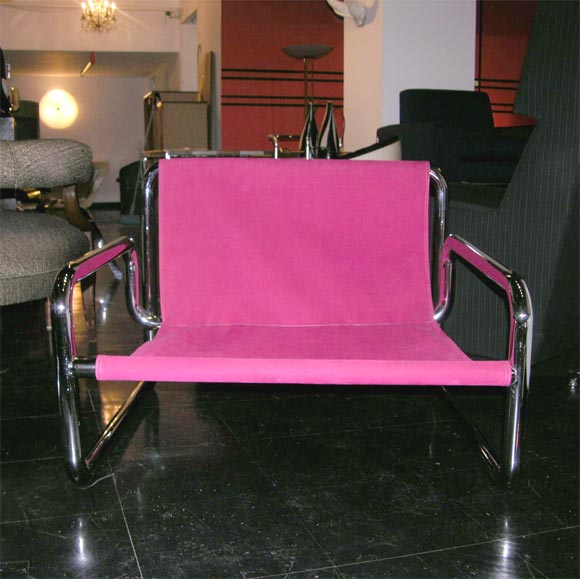 Chrome tubular lounge chair is upholstered in sizzling hot pink Ultrasuede.