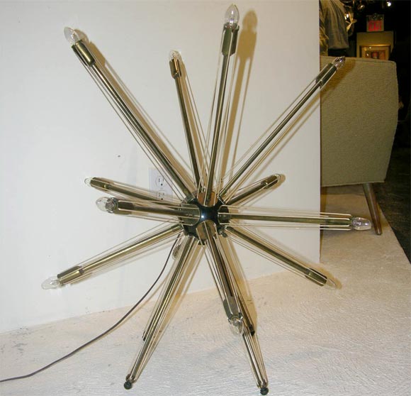 Standing lamp with multiple armatures, more akin to satellite than Sputnik.<br />
Of either American or Italian origin, from the early 1950's.  Rare, especially with<br />
the original reinforced string guidelines intact.  A strong visual