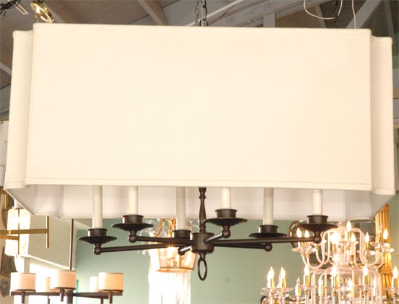 Modern Shaded Six Arm Chandelier by Paul Marra Design with turned center stem, oil rubbed bronze finish, scalloped linen shade and paper candle covers. Also available in a variety of finishes and shades; contact us for lead time.  Custom sizes