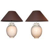 A pair of bisque ceramic lamps