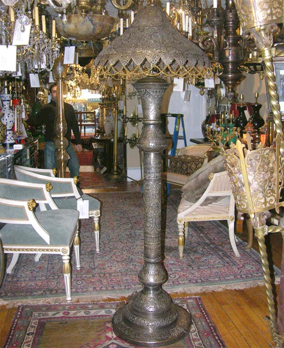 This unique Middle-Eastern pierced bronze floor lamp with beading on the shade measures an admirable 71