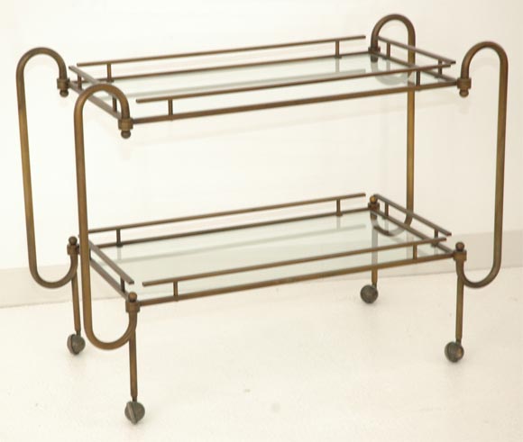 A Patinated Bronze and Glass Drinks Trolley