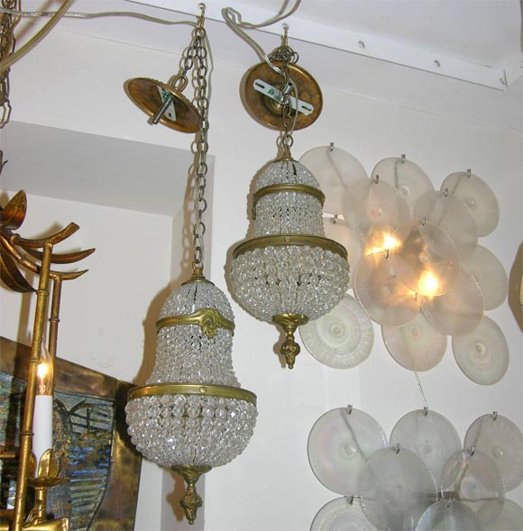 Pair of small scale beaded glass and brass chandeliers