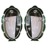 Pair of English Art Deco oval mirrors