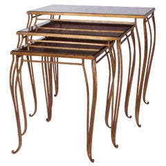French nesting tables of gilded iron