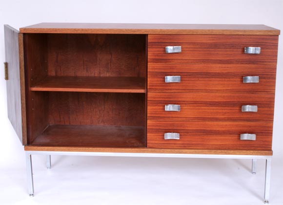 French rosewood cabinet by Jacqueline Lecoq and Antoine Philippon. 4 drawers, 1 door cabinet with ergonomic formed cast aluminum handles and legs. Similar pieces shown in Les Decorateurs des Francais 50's p 267