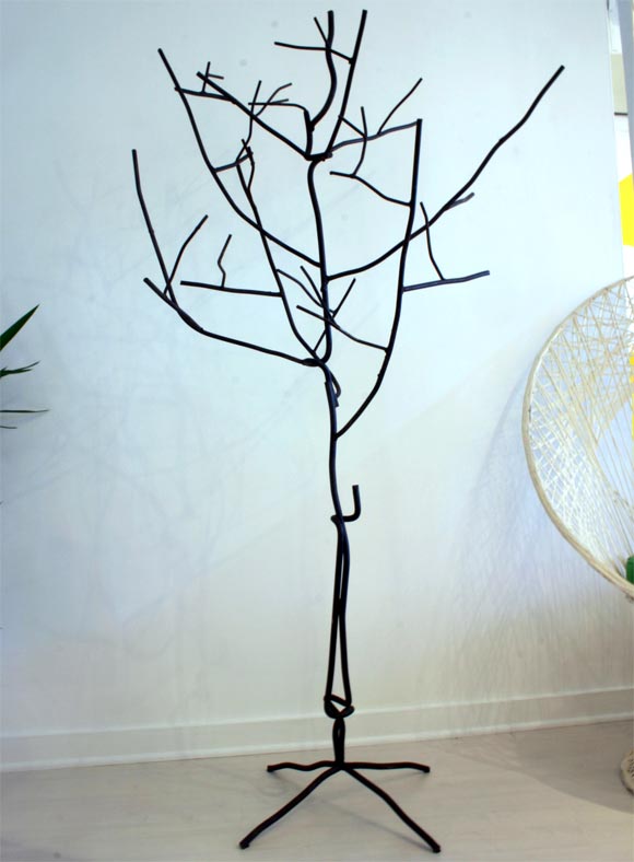 Metal is twisted to make different angles and directions.  <br />
Could be used as an abstract coat rack.