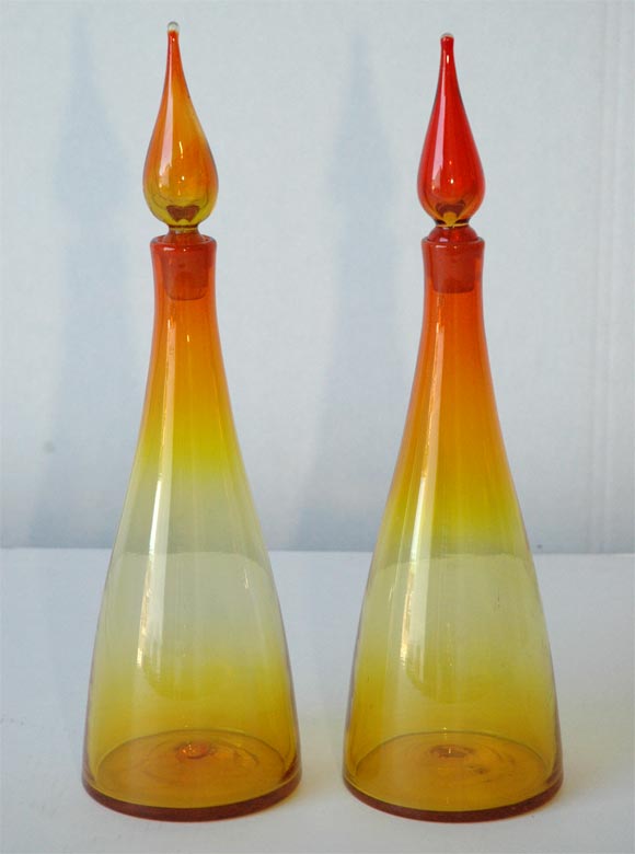 Pair of Blenko Glass Decanters with original teardrop stoppers intact. Red to orange to yellow color variation.