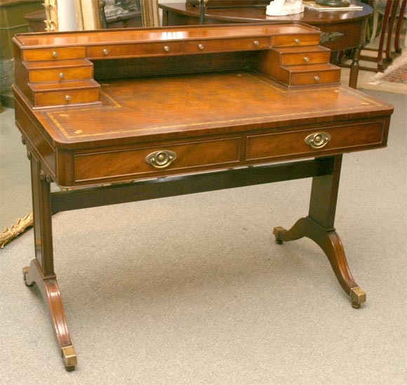 Regency style desk made by Baker. Circa 1940. Original leather top.
