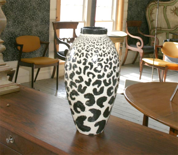 Unusual tall vase from the Kähler Pottery factory in Denmark, in white with thick black applique in an animal pattern, signed 
O. Knudsen, HAK.