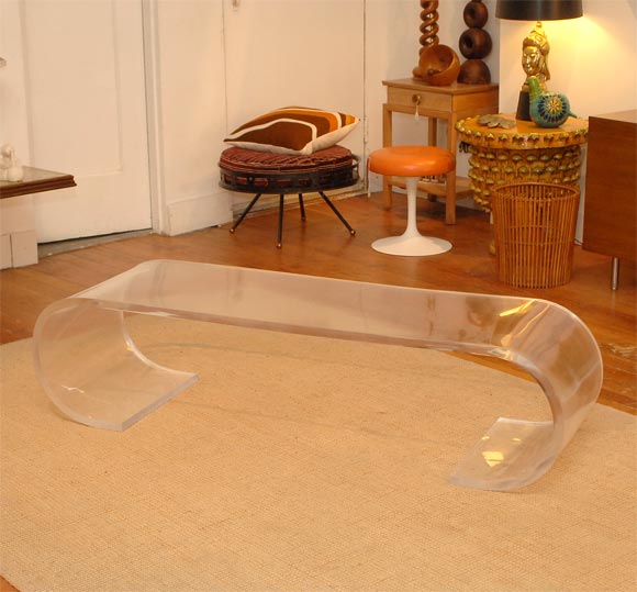 Lucite scroll form coffee table or bench.