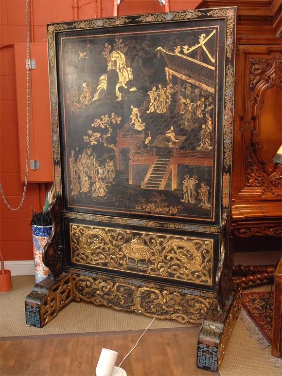 Painted on two sides with the first side depicting the Emperor seated under a canopy with his concubine in attendance with mountains and trees in the distance, and on the reverse side a poem written in classical chinese; the 20th Century frame and