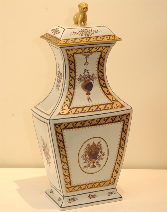 Pair of covered urns with beautiful gold and purple colored ceramic with a primitive lion figure on top. These are hand painted inspired by Chinese exports and made in Italy about 1960. Personally appraised in 1992 at $1500 each by Mildred
