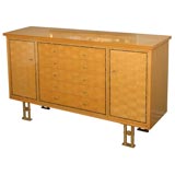 Sycamore chest of drawers with bronze supports by Jules Leleu