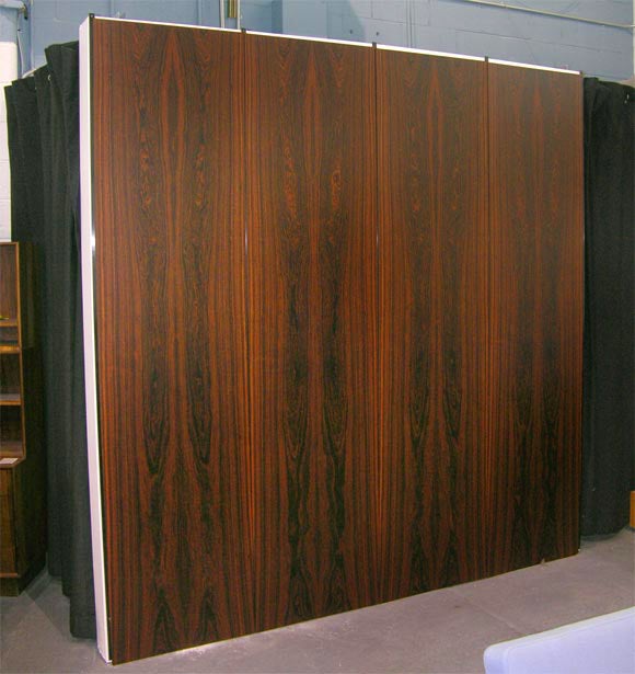 Rosewood veneered wall panels from the 1960's never used, still in packaging.  100 panels available! The pattern of the venner matches in sets of 5 - 6 panels.  Can be purchased in any quantity .