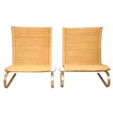 Pair of Poul Kjaerholm Rattan and Steel Sidechairs