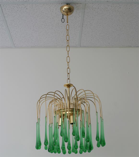 Small chandelier with 3 circles of green emerald drops and golden frame with chain. <br />
3 bulbs required.