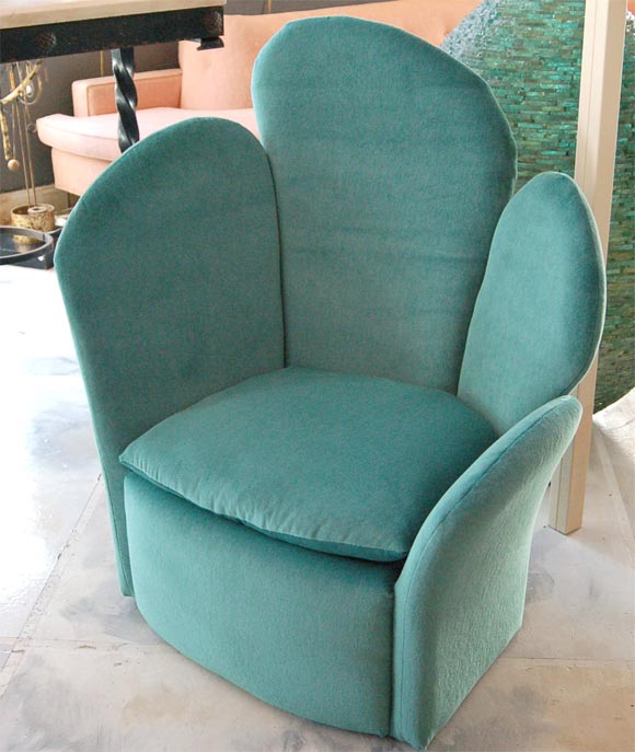 Mod and cozy chair envelopes you in warm and fuzzy mohair velvet.