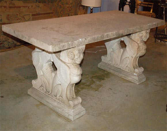 An exceptionally carved Italian Cararra Marble Center Table with winged griffin supports topped by a 2 1/2 inch thick piece of Cararra marble. Circe 1860 to 1880.