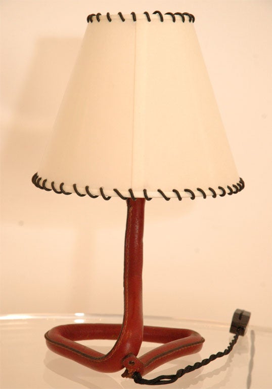 A Jacques Adnet Table Lamp in Red Leather
