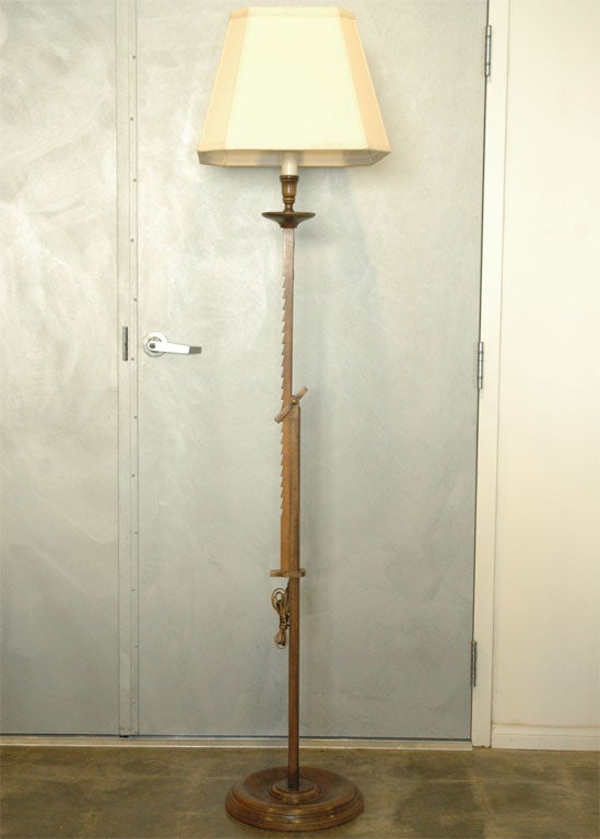 A most unusual type floor lamp with a method of adjusting up and down in steps. Not your everyday find in the lamp department. Jefferson West Antiques offer a large variety of interesting antique mirrors, furniture, lighting and one of decorative