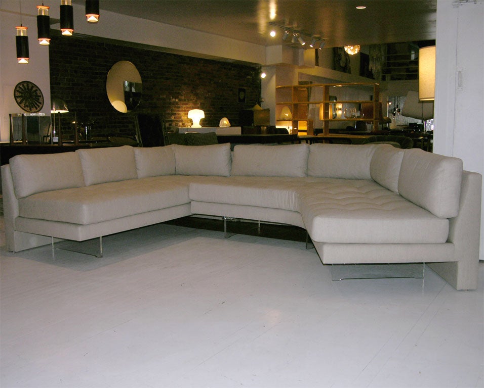 VLADIMIR KAGAN TWO PIECE SECTIONAL SOFA WITH LUCITE LEGS.