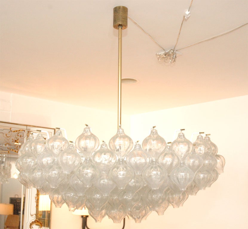Exquisite chandelier with over 200 hand blown individual bottles suspended from a 36