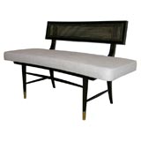 A Curved Upholstered Bench.