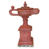 A Rosso Marmo Carved Double Loop Oil Lamp