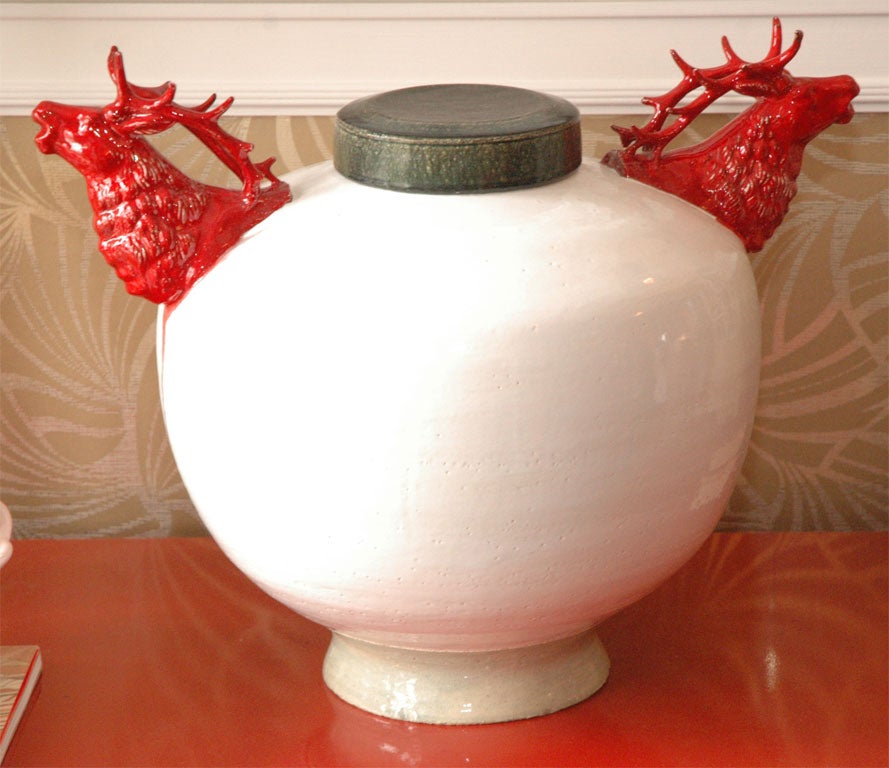 Gorgeous bone white ceramic hand-thrown vessel with cast crimson red elk heads made by Los Angeles artist Stephen Fleitz. Mottled obsidian multicolor glaze for the top.
