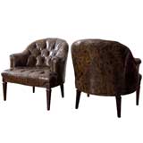 Pair of tufted tortoise shell leather chairs
