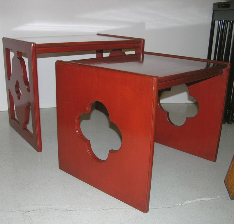 Nest of tables in Chinese red with cut-out design on the sides