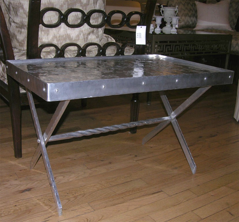 Unique aluminum tray table made by the Wendell August Forge with hand hammered repousse flowers.  See matching wastebasket listed separately.