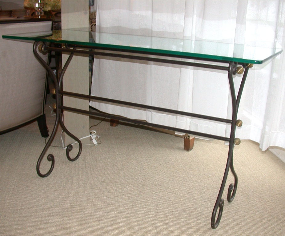 Attractive wrought iron console table with glass top