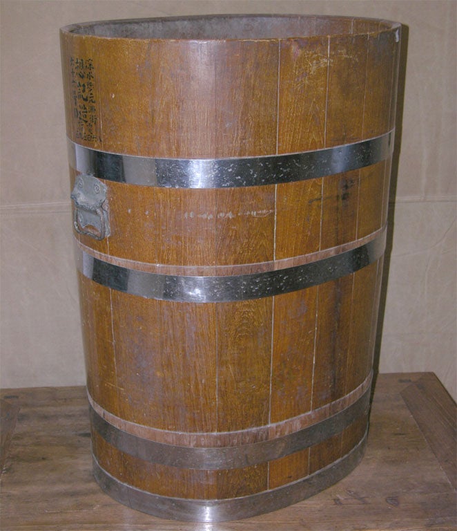 a handmade barrel to hold rice for selling at the market place.