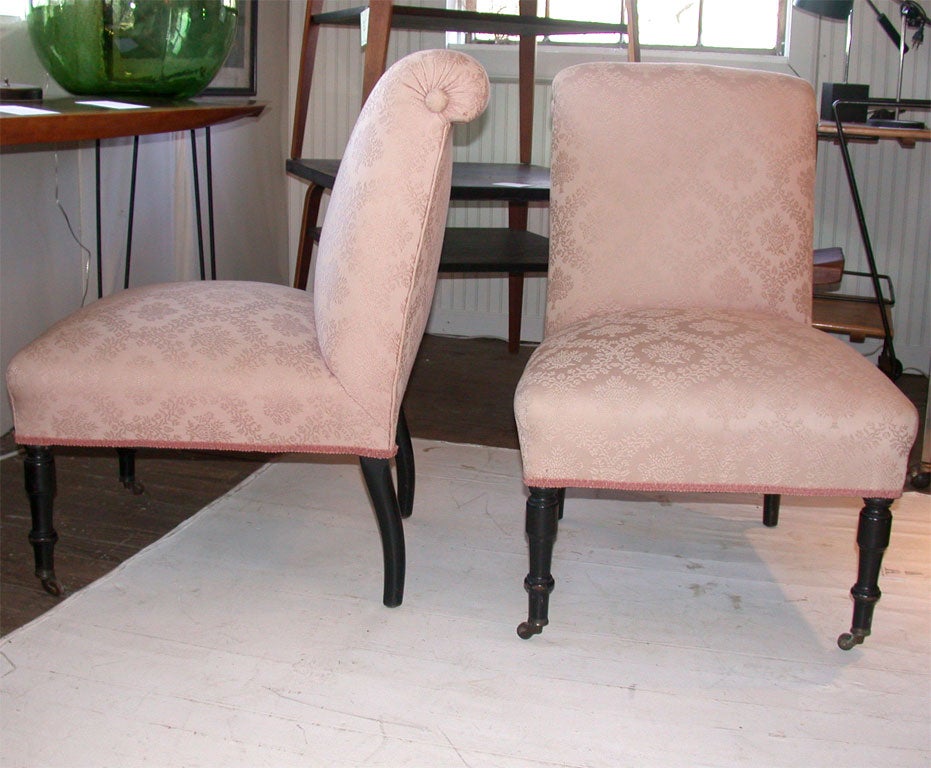 Roll back slipper chairs Mahogany legs with castors