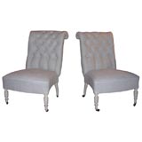 A pair of French Napoleon III style slipper chairs