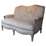 Louis XV style serpentine shaped back sofa.