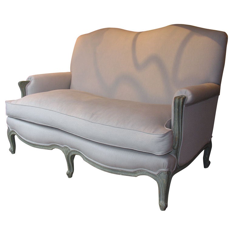 Louis XV style serpentine shaped back sofa.